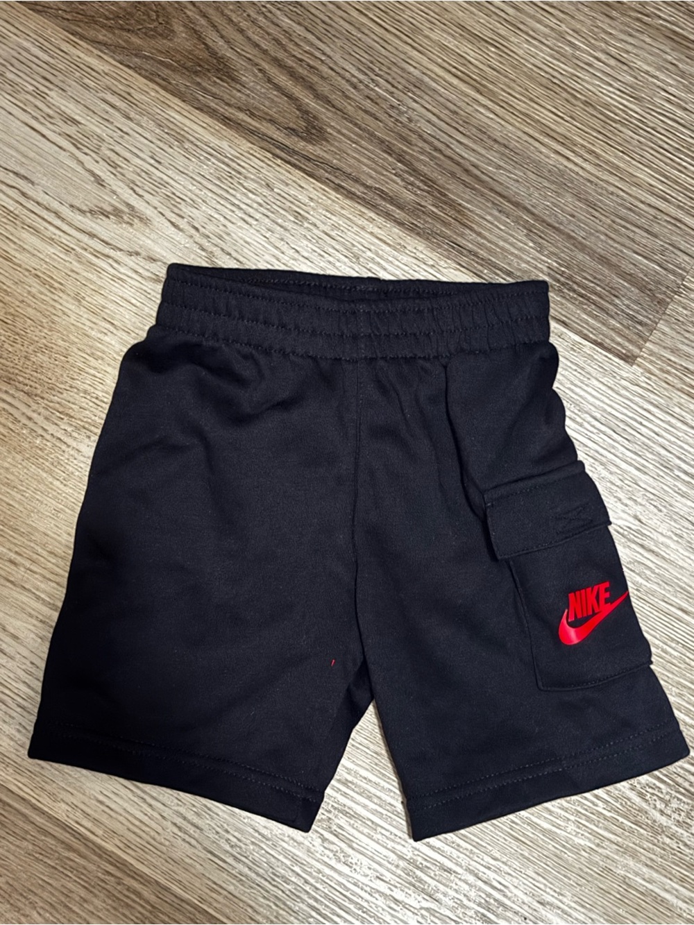 Nike Black Kids Shorts with Red Swoosh